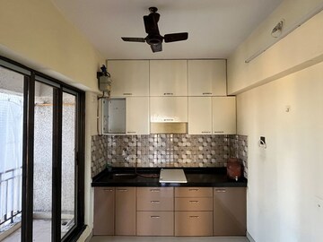 Kitchen in 2 BHK Apartment at Sunshine Tower, Asha Nagar – for Rent