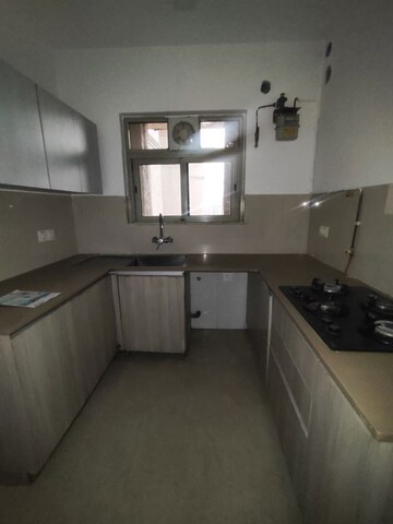 Kitchen in 2 BHK Apartment at Hiranandani Woodpark Apartment, Ghodbunder Road – for Rent