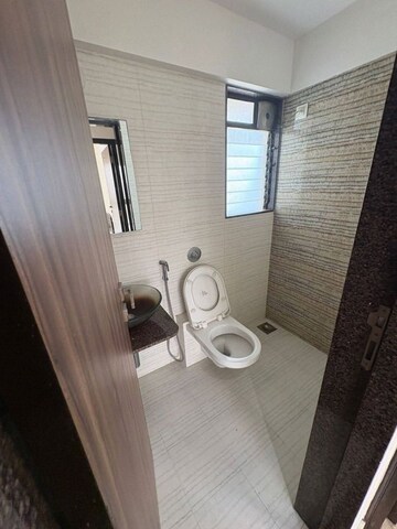 Bathroom in 2 BHK Apartment at Dn Nagar – for Rent