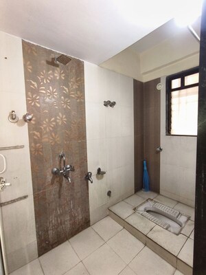 Bathroom in 2 BHK Apartment at Puranik City, Kasarvadavali – for Rent