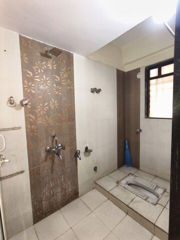 Bathroom in 2 BHK Apartment at Puranik City, Kasarvadavali – for Rent