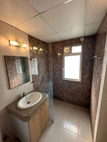 Bathroom in 1 RK Apartment at Nimbus The Golden Palm, Sector 168 – for Rent