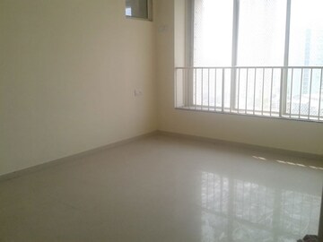 Room in 2.5 BHK Apartment at Rustomjee OZone, Goregaon West – for Sale