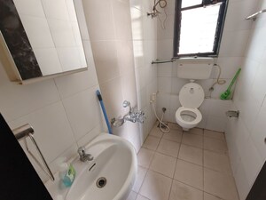 Bathroom in 1 BHK Apartment at Cosmos Jewels, Ghodbunder Road – for Rent