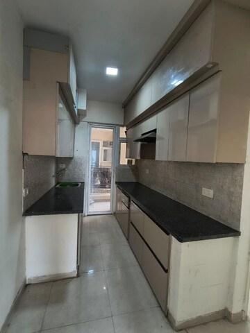 Kitchen in 2 BHK Apartment at Signature The Millennia 3, Sector 37d – for Rent