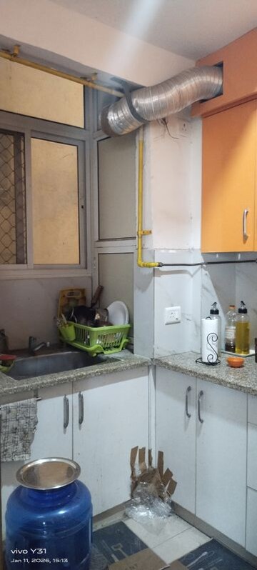Kitchen in 2 BHK Apartment at Mahagun Mywoods, Sector 16c Greater Noida – for Rent