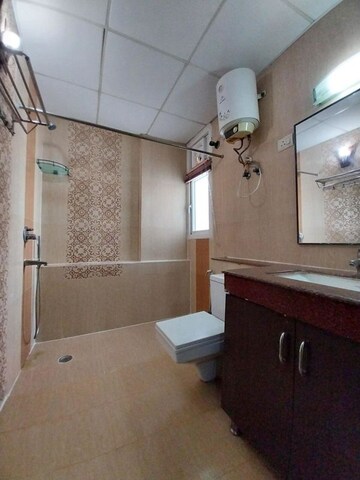 Bathroom in 3 BHK Apartment at Purvanchal Royal Park, Sector 137 – for Rent