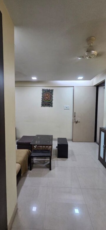 Living Room in 1 BHK Apartment at Kopar Khairane – for Sale
