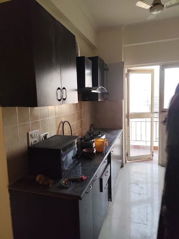Kitchen in 2.5 BHK Apartment at Aims Golf City, Sector 75 – for Sale