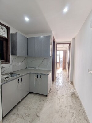 Kitchen in 1 BHK Apartment at Chattarpur – for Sale