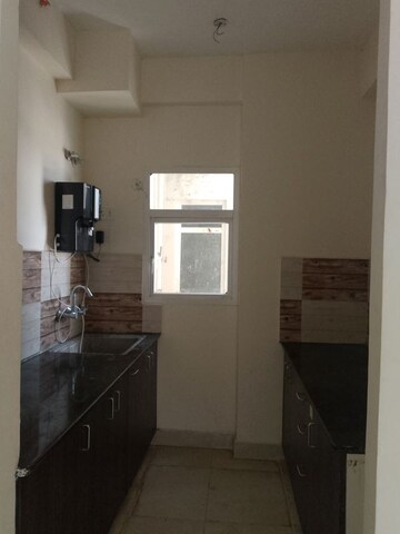 Kitchen in 2 BHK Apartment at Amrapali Enchante, Tech Zone 4 Greater Noida – for Rent