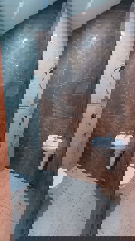 Bathroom in 2.5 BHK Builder Floor at Adil Nagar – for Sale