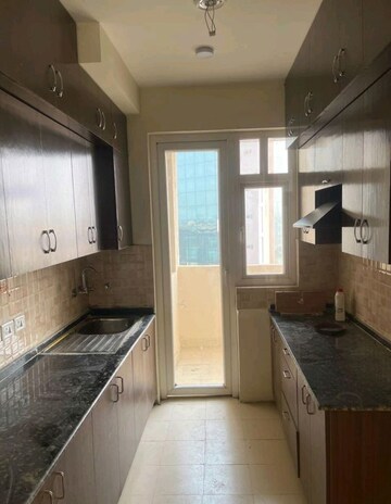 Kitchen in 3 BHK Apartment at Amrapali Heartbeat City, Sector 107 – for Rent