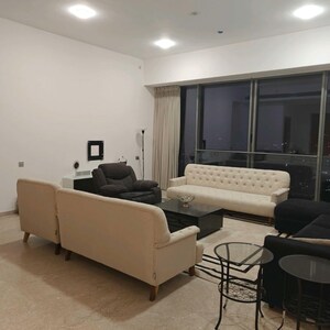 Living Room in 4 BHK Apartment at Rustomjee Crown, Gokhale Road – for Rent