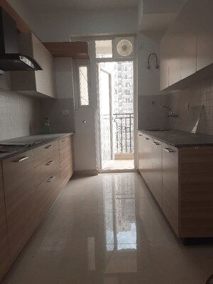 Kitchen in 3 BHK Apartment at Mahagun Mywoods, Sector 16c Greater Noida – for Rent