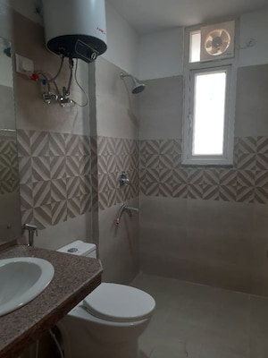 Bathroom in 3 BHK Apartment at Mahagun Mywoods, Sector 16c Greater Noida – for Rent