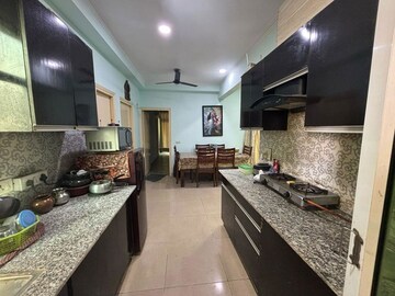 Kitchen in 2 BHK Apartment at Mahagun Mywoods, Sector 16c Greater Noida – for Rent