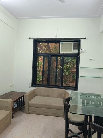 Living Room in 1 BHK Apartment at Vinod Villa Worli, Worli – for Rent