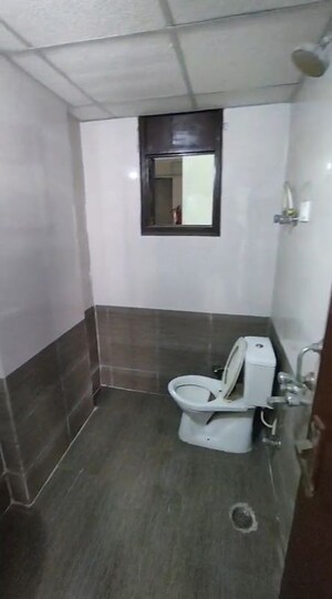 Bathroom in 2 BHK Apartment at Shyam Bankey Bihari Sharnam, Raj Nagar Extension – for Sale