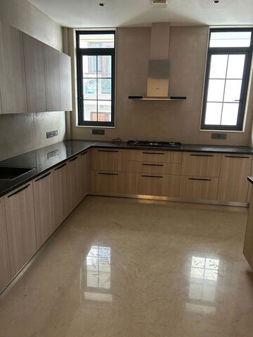 Kitchen in 4 BHK Apartment at Vasant Vihar – for Sale