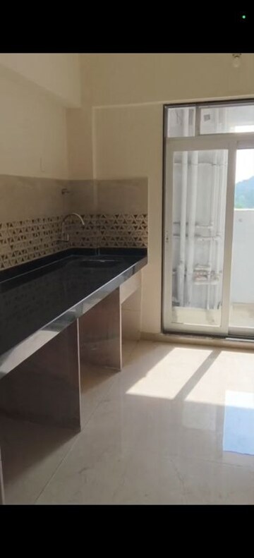 Kitchen in 3 BHK Apartment at Mahavir Square, Manpada – for Sale