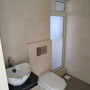 Bathroom in 2 BHK Apartment at Marathon Nexworld Aura, Betwade – for Rent