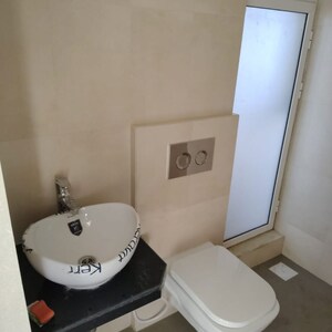 Bathroom in 2 BHK Apartment at Marathon Nexworld Aura, Betwade – for Rent