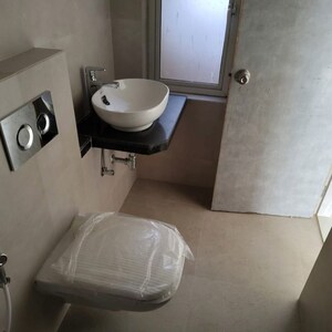 Bathroom in 2 BHK Apartment at Marathon Nexworld Aura, Betwade – for Rent