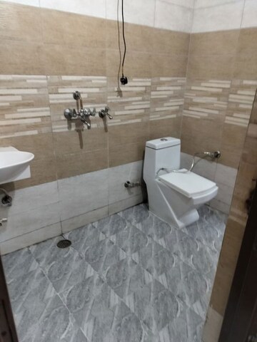 Bathroom in 3 BHK Builder Floor at Dhakoli – for Sale