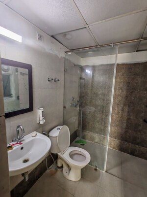 Bathroom in 3 BHK Apartment at Raj Nagar Extension – for Sale