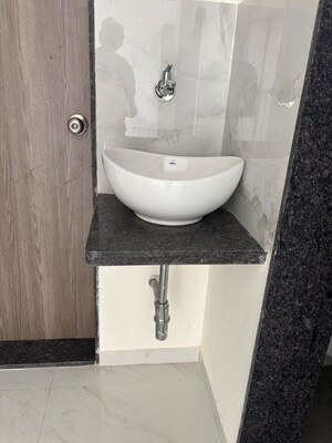 Bathroom in 1 BHK Apartment at Raunak Unnathi Woods Phase 6, Ghodbunder Road – for Sale