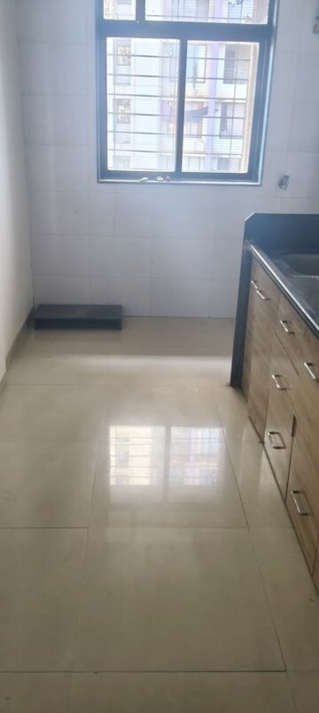 Kitchen in 1 BHK Apartment at Ram Pushpanjali Residency, Owale – for Sale