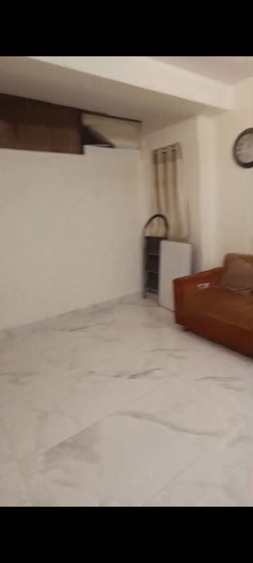 Living Room in 1 BHK Apartment at Vile Parle East – for Rent