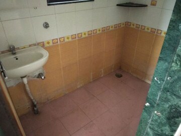 Bathroom in 2 BHK Apartment at Amey River View , Anand Nagar – for Rent