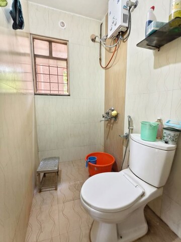 Bathroom in 2 BHK Apartment at Amey River View , Anand Nagar – for Rent