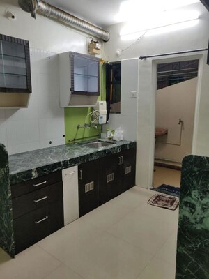 Kitchen in 2 BHK Apartment at Amey River View , Anand Nagar – for Rent
