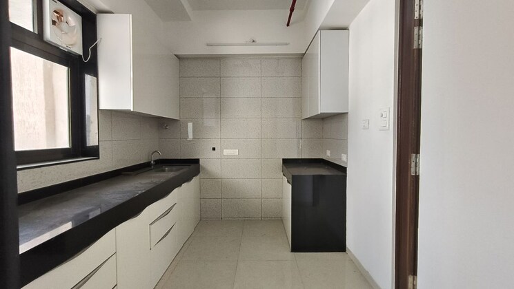 Kitchen, peninsula-celestia-spaces 2 Bedroom 840 Sq.Ft. Apartment In Parel Mumbai 9787548