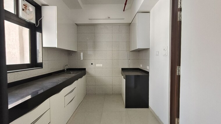 Kitchen, peninsula-celestia-spaces 2 Bedroom 840 Sq.Ft. Apartment In Parel Mumbai 9787548