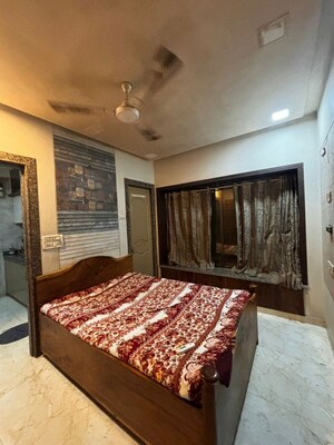 Bedroom in 3 BHK Apartment at Rajgir Milap CHS, Andheri West – for Rent