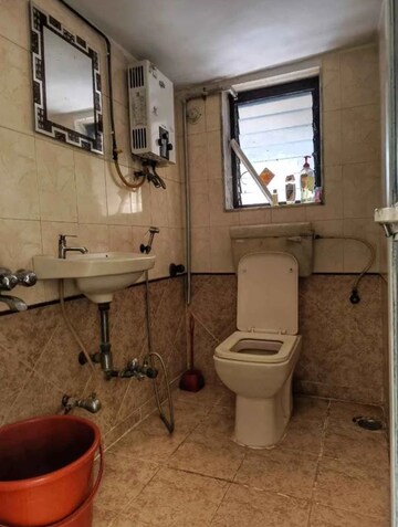 Bathroom in 1 BHK Apartment at Abrol Krishna Utsav, Malad West – for Rent