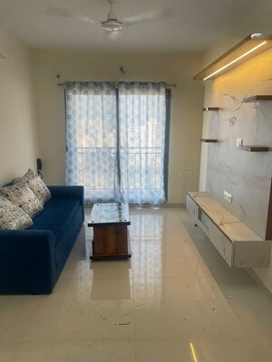 Living Room in 2 BHK Apartment at Raunak Unnathi Greens, Kasarvadavali – for Rent