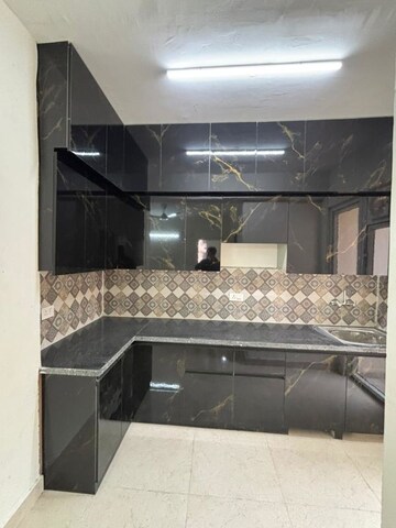 Kitchen in 2 BHK Apartment at Signature The Millennia 3, Sector 37d – for Rent