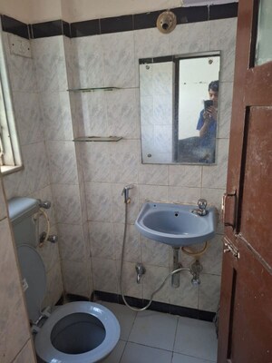 Bathroom in 1 BHK Apartment at Dheeraj Valley, Goregaon East – for Rent