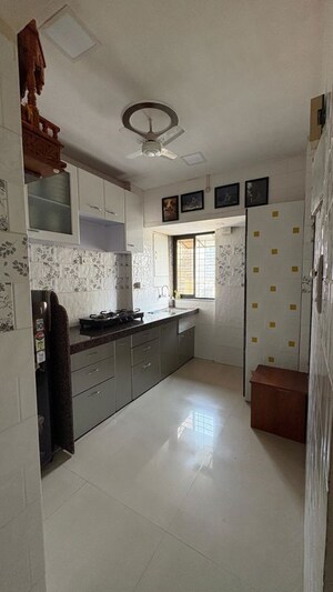 Kitchen in 3 BHK Apartment at Dosti Imperia Phase I, Ghodbunder Road – for Rent