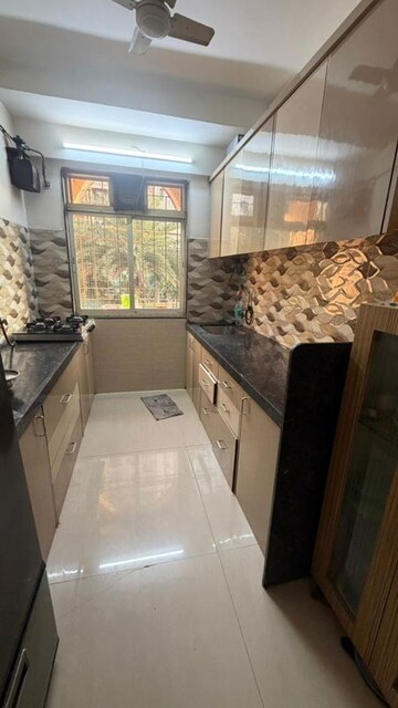 Kitchen in 2 BHK Apartment at Dosti Acres Aster, Wadala East – for Rent