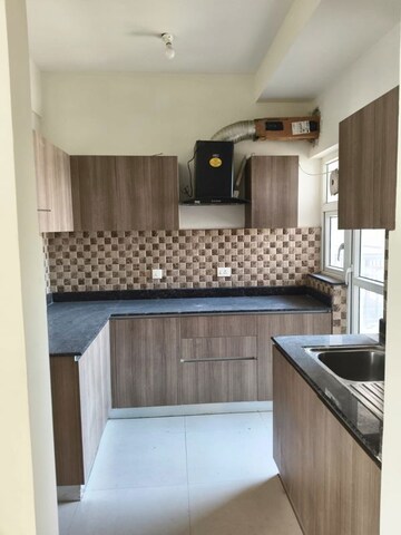 Kitchen in 3 BHK Apartment at Adani Oyster Grande Phase 2, Sector 102 – for Rent