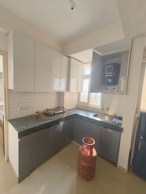 Kitchen in 1 BHK Apartment at Shree Vardhman Green Court, Sector 90 – for Rent