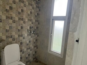 Bathroom in 3 BHK Apartment at Nilaya Greens, Raj Nagar Extension – for Rent