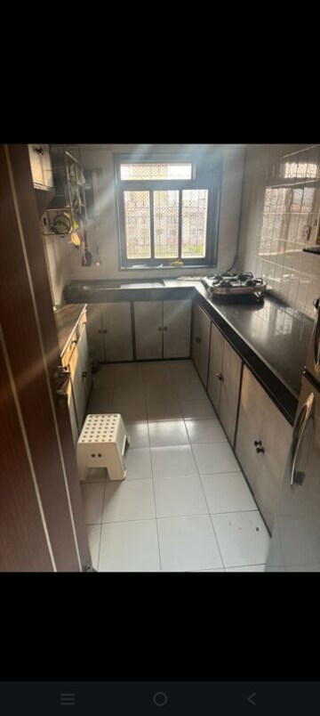 Kitchen in 2 BHK Apartment at Crystal Garden Estate CHS, Manpada – for Rent