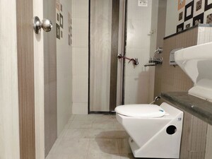 Bathroom in 3 BHK Apartment at Jangid Galaxy, Ghodbunder Road – for Rent